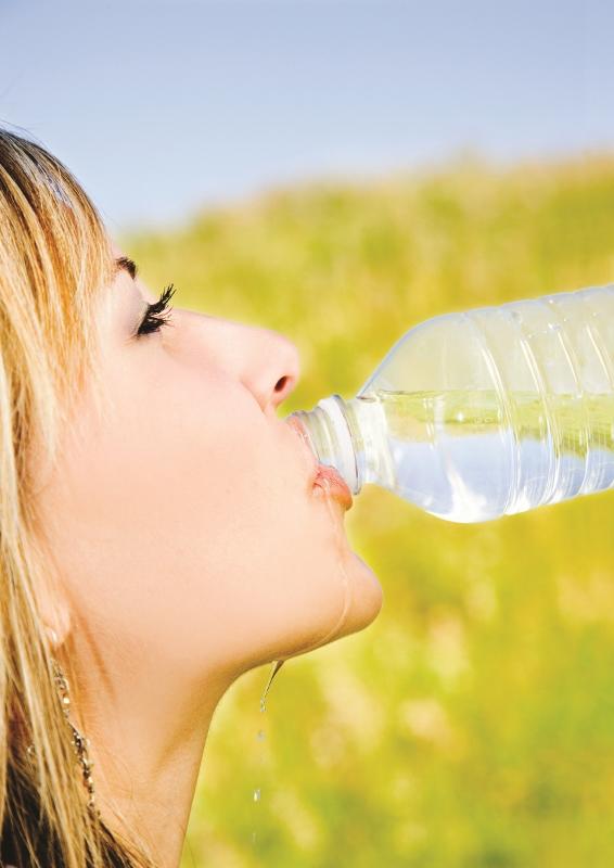 Woman drinking bottled water